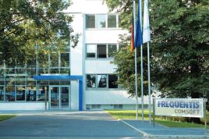 outside view of office building; showing the company logo Frequentis Comsoft and the entrance