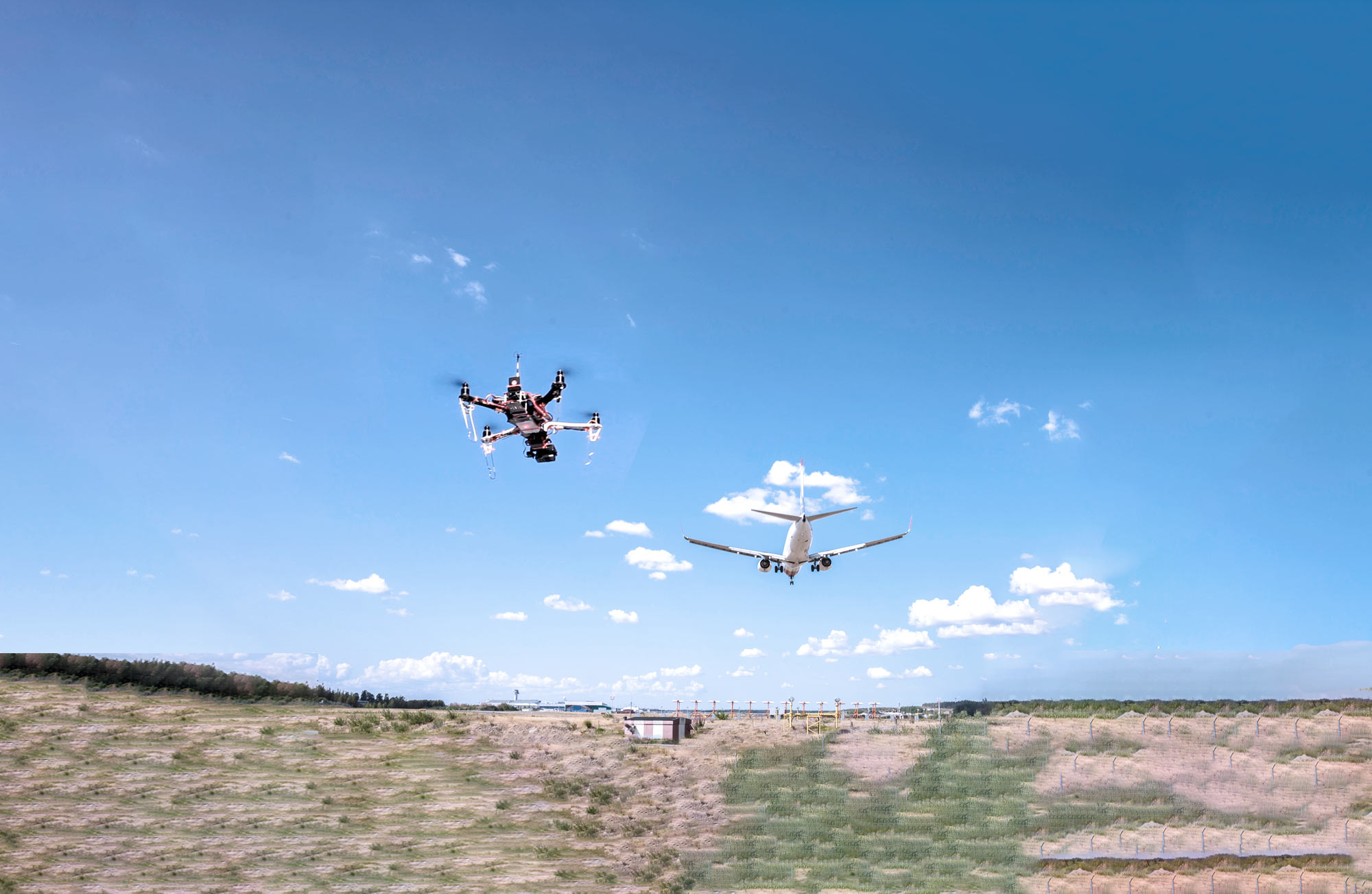 Converging airspace management, showing a drone and a plane in the sky