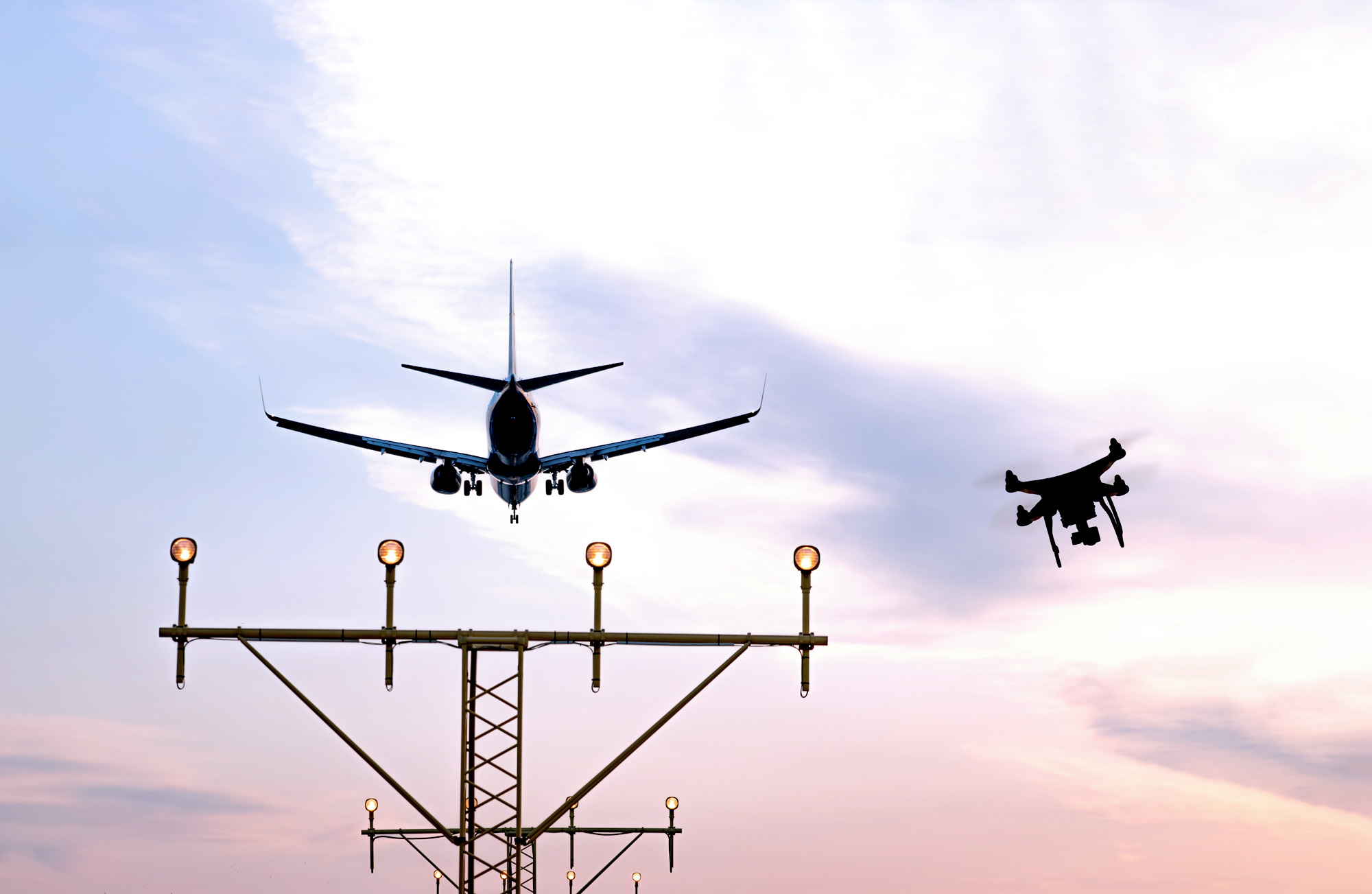 enabling technologies, showing an airplane departure and a drone in the sky