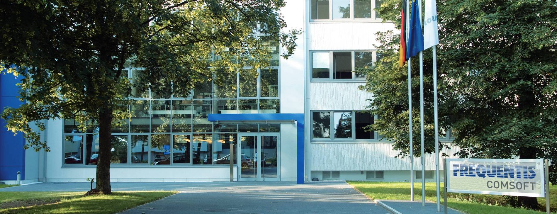 outside view of office building; showing the company logo Frequentis Comsoft and the entrance